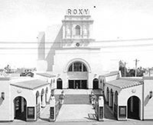 Historic black and white exterior of the Roxy